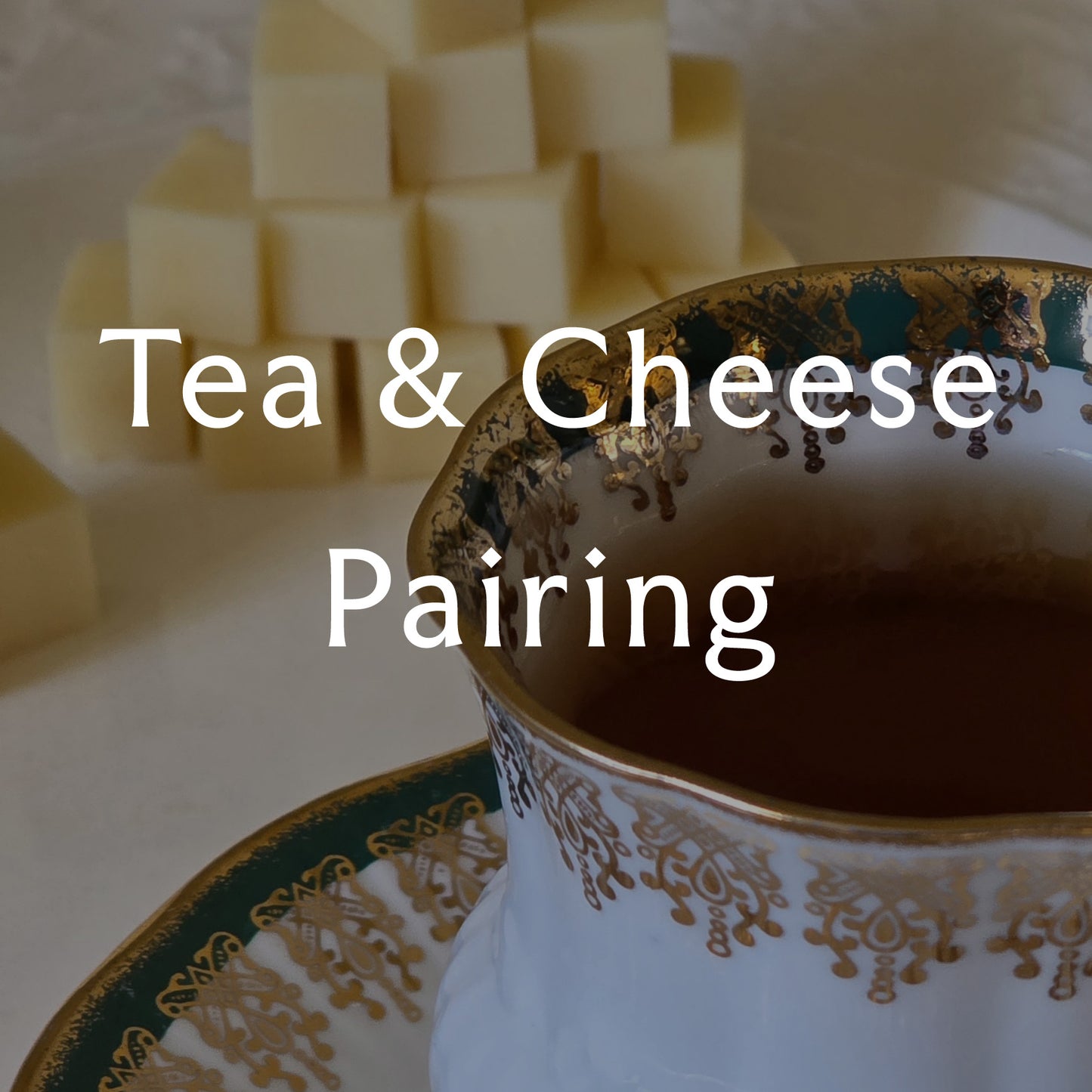 Tea cup with decorative patterns and cheese cubes on a white background overlaid with the text 'Tea & Cheese Pairing'