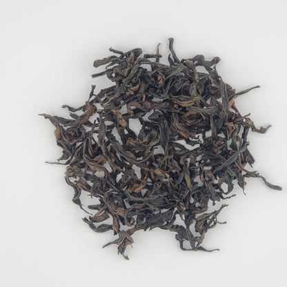 Close up of tea leaves on a white background