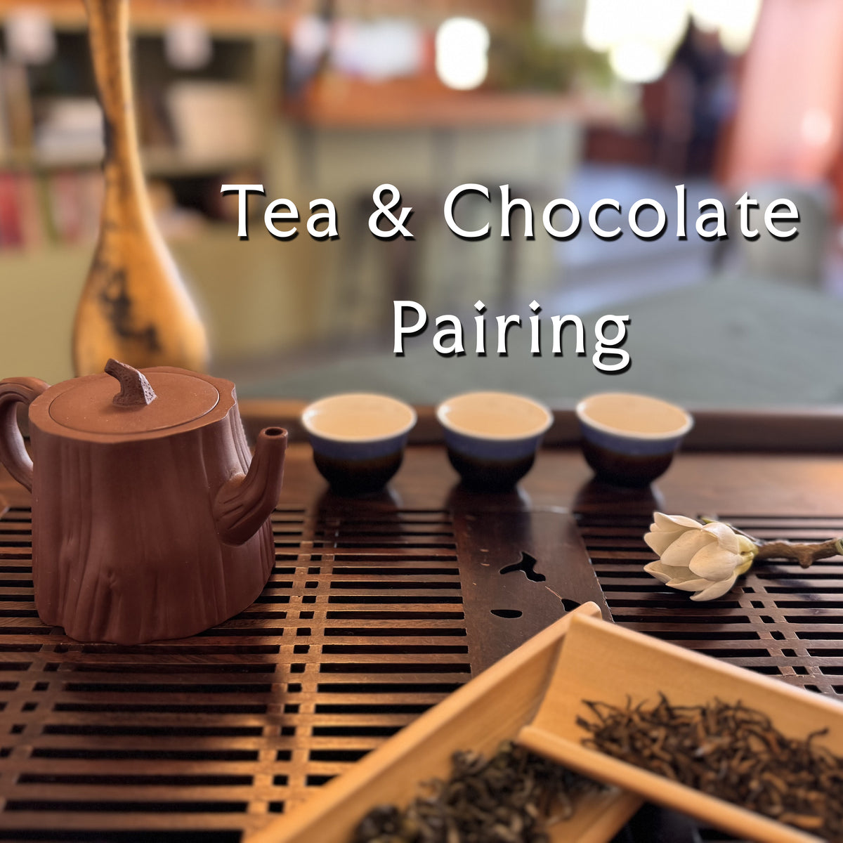 Tea tray with tea pot, cups, and tea leaves, overlayed with the text 'Tea & Chocolate Pairing'