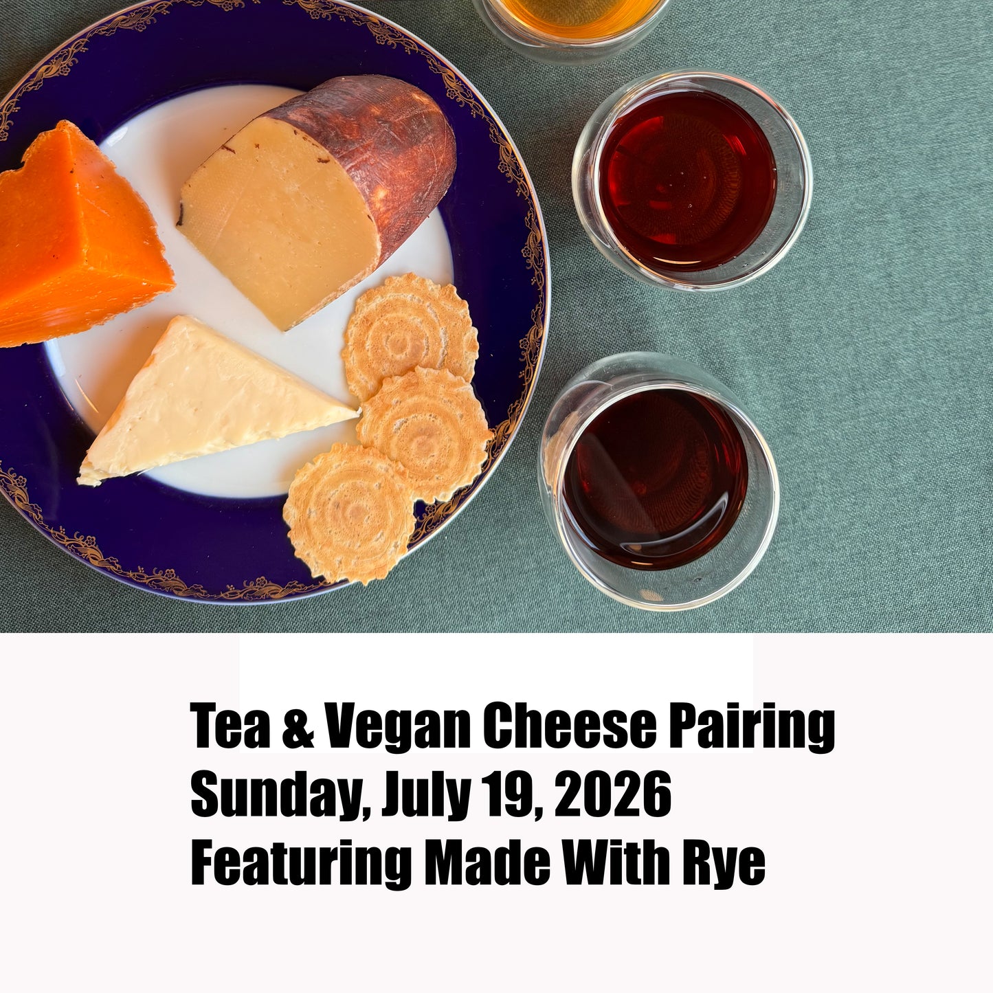 Tea & vegan cheese display with text regarding the event