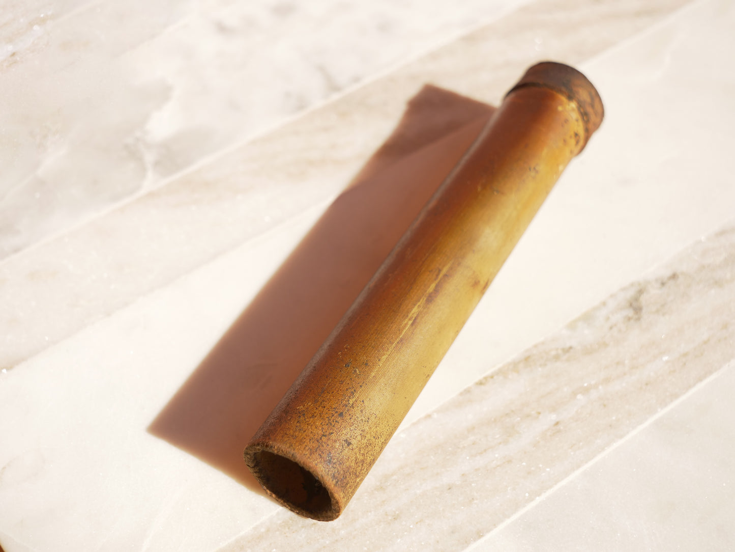 Bamboo tube on a marble surface