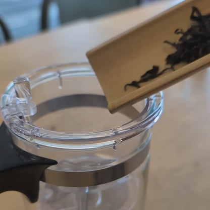 Video showing how to use the teapot - adding tea leaves, adding hot water, and then pressing the button to release the tea into the lower chamber after brewing.