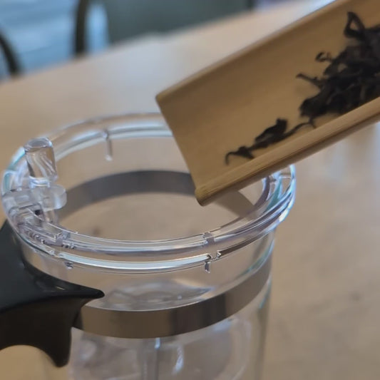 Video showing how to use the teapot - adding tea leaves, adding hot water, and then pressing the button to release the tea into the lower chamber after brewing.