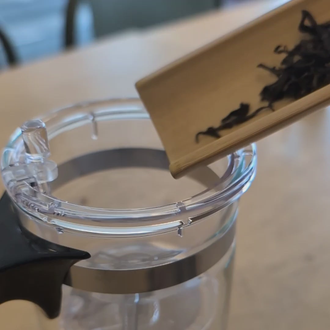 Video showing how to use the teapot - adding tea leaves, adding hot water, and then pressing the button to release the tea into the lower chamber after brewing.